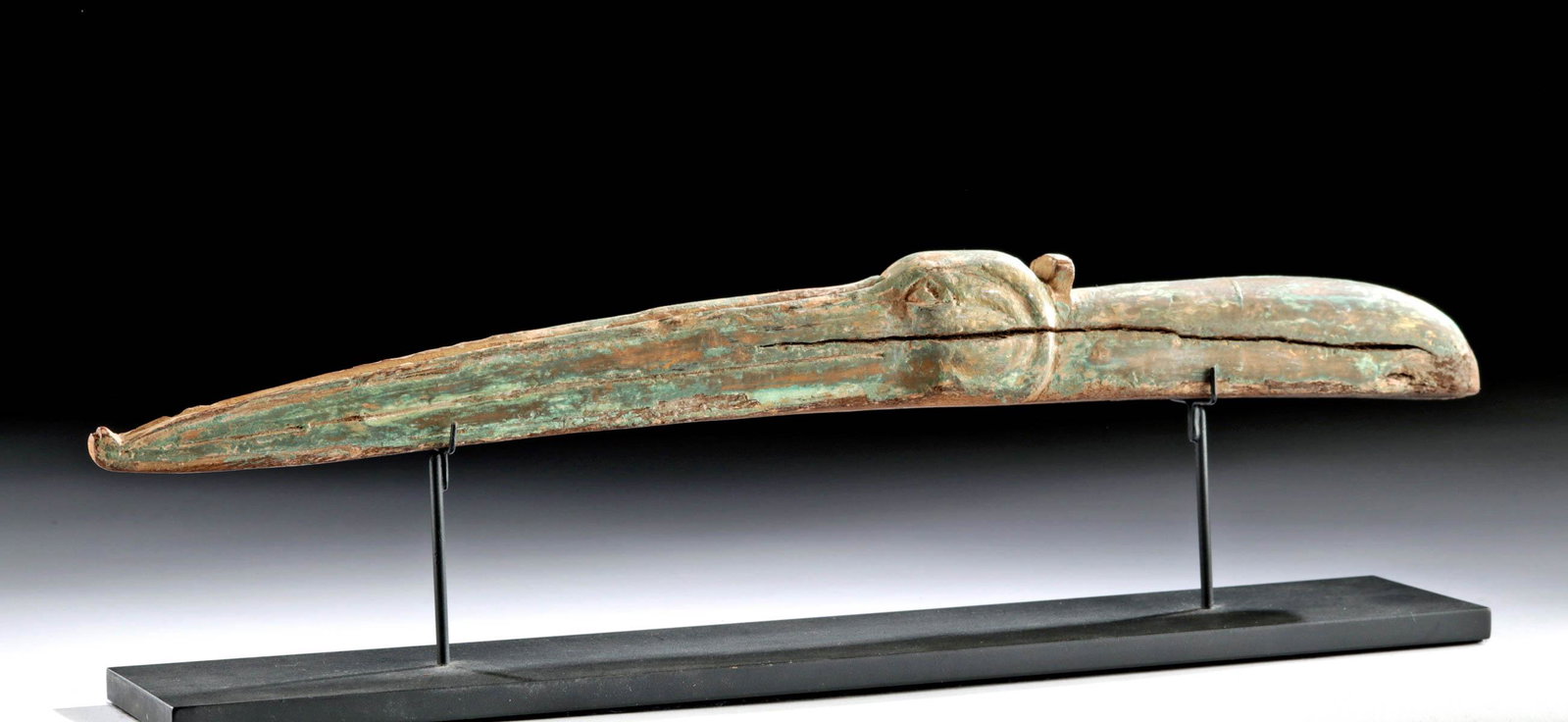Impressive Egyptian Gesso'd Wood Head of an Ibis: Ancient Egypt, Third Intermediate to Late Dynastic Period, ca. 1070 to 332 BCE. A dramatic, playful head of an ibis, carved with a dramatically long beak, a large eye, incised curves behind the eye gi