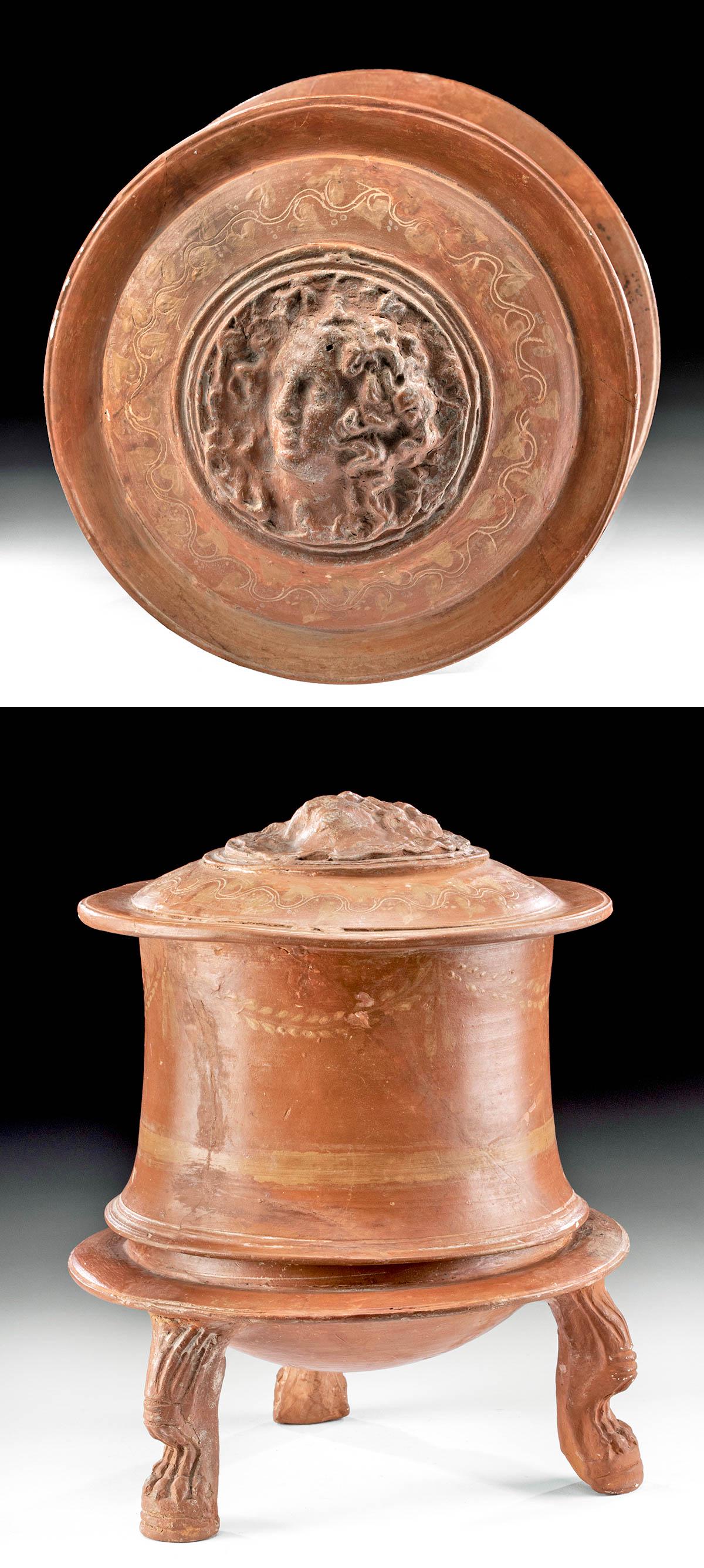Greek Hellenistic Pottery Lidded Pyxis, ex-Sotheby's: Greece, Hellenistic period, ca. 3rd to 2nd century BCE. Presenting with breathtaking form, a wheel-thrown pyxis with a bell-shaped lower body resting upon three molded pottery lion's legs. The base fe