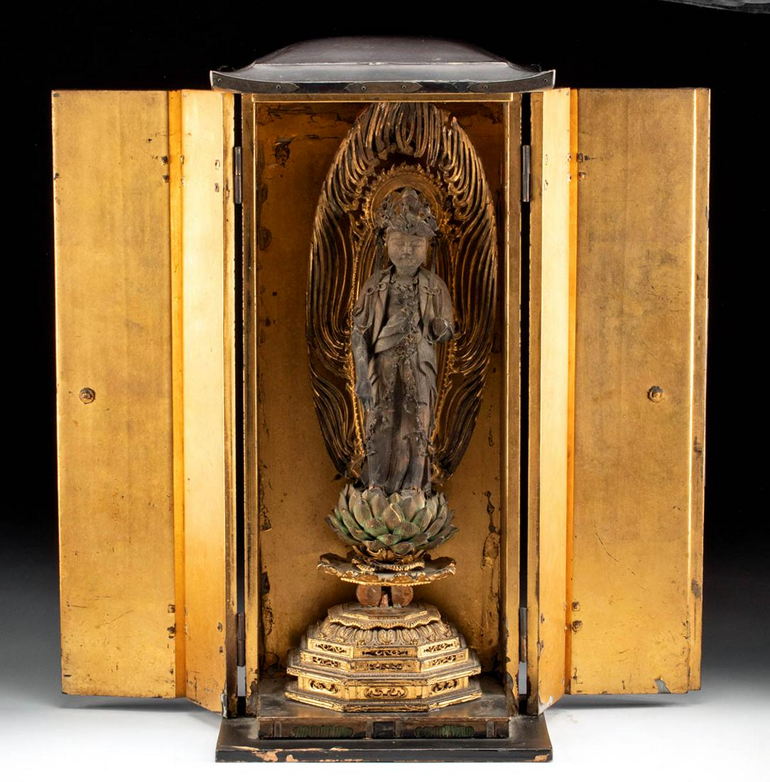Japanese Meiji Gilt Wood Zushi Shrine w/ Bodhisattva: East Asia, Japan, early Meiji, ca. 1880 CE. A finely carved and gilded wooden zushi (a petite Buddhist shrine) portraying a Bodhisattva standing atop a lotus blossom. The gilding on this piece is exte