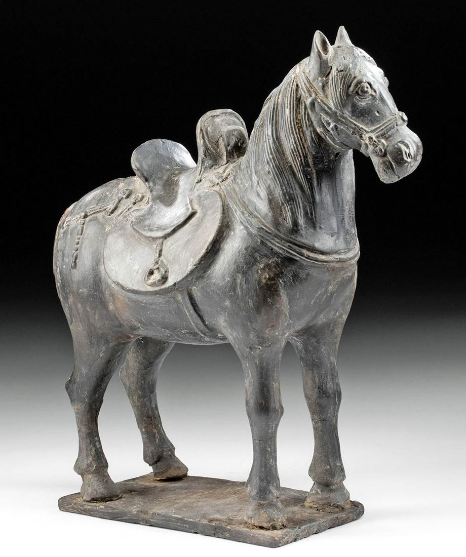 Mongolian Ming Dynasty Pottery Horse: East Asia, China, Ming Dynasty, 1368 to 1644 CE. A very fine blackware Mongolian horse, depicted standing upon a rectangular plinth, with a substantial saddle on its back, well-delineated reins, long 