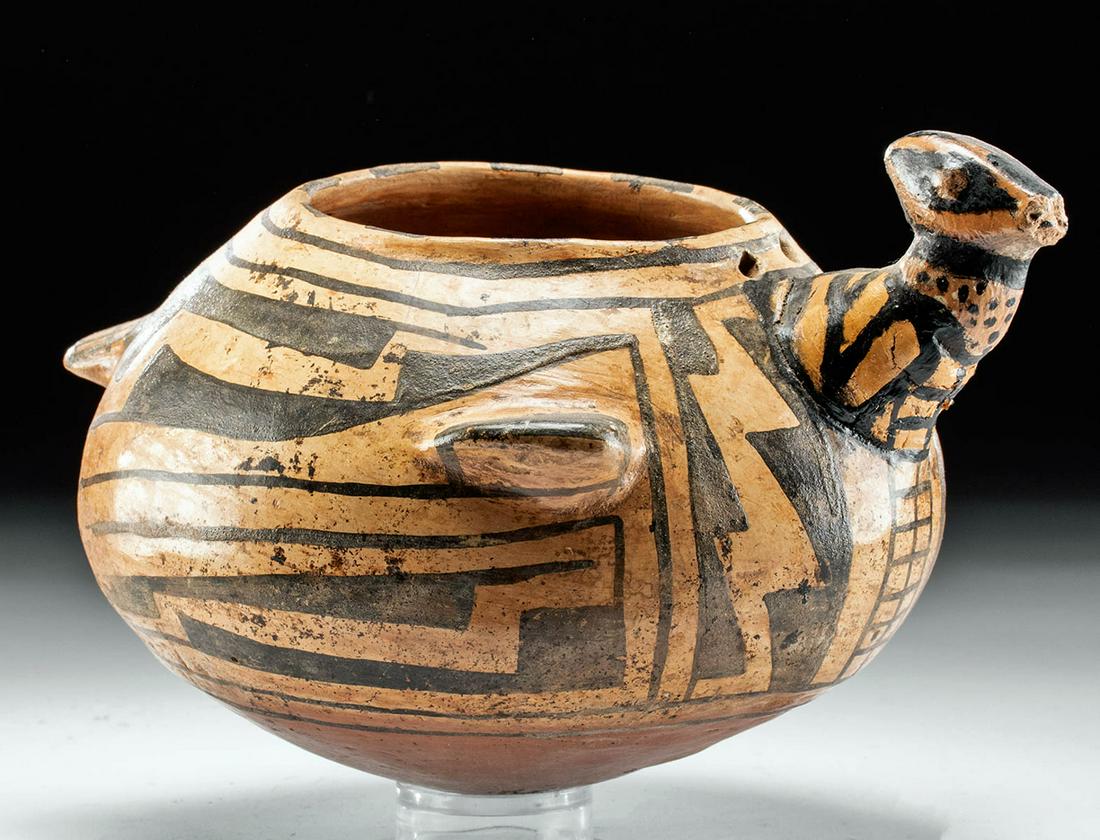 Casas Grandes Polychrome Avian Vessel: **First Time At Auction** Pre-Columbian, Northern Mexico, Casas Grandes, ca. 1250 to 1475 CE. A wonderful example from the Casas Grandes culture, this rounded vessel presents with avian features - wit