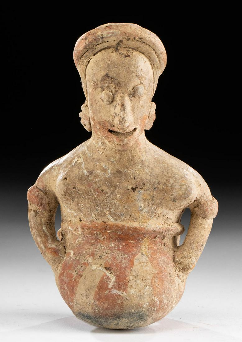 Nayarit Bi-chrome Kneeling Figure: **First Time At Auction** Pre-Columbian, West Mexico, Nayarit, ca. 300 BCE to 300 CE. A haunting kneeling figure, hand modeled from pottery and painted with red details on the buff pale brown ground. 