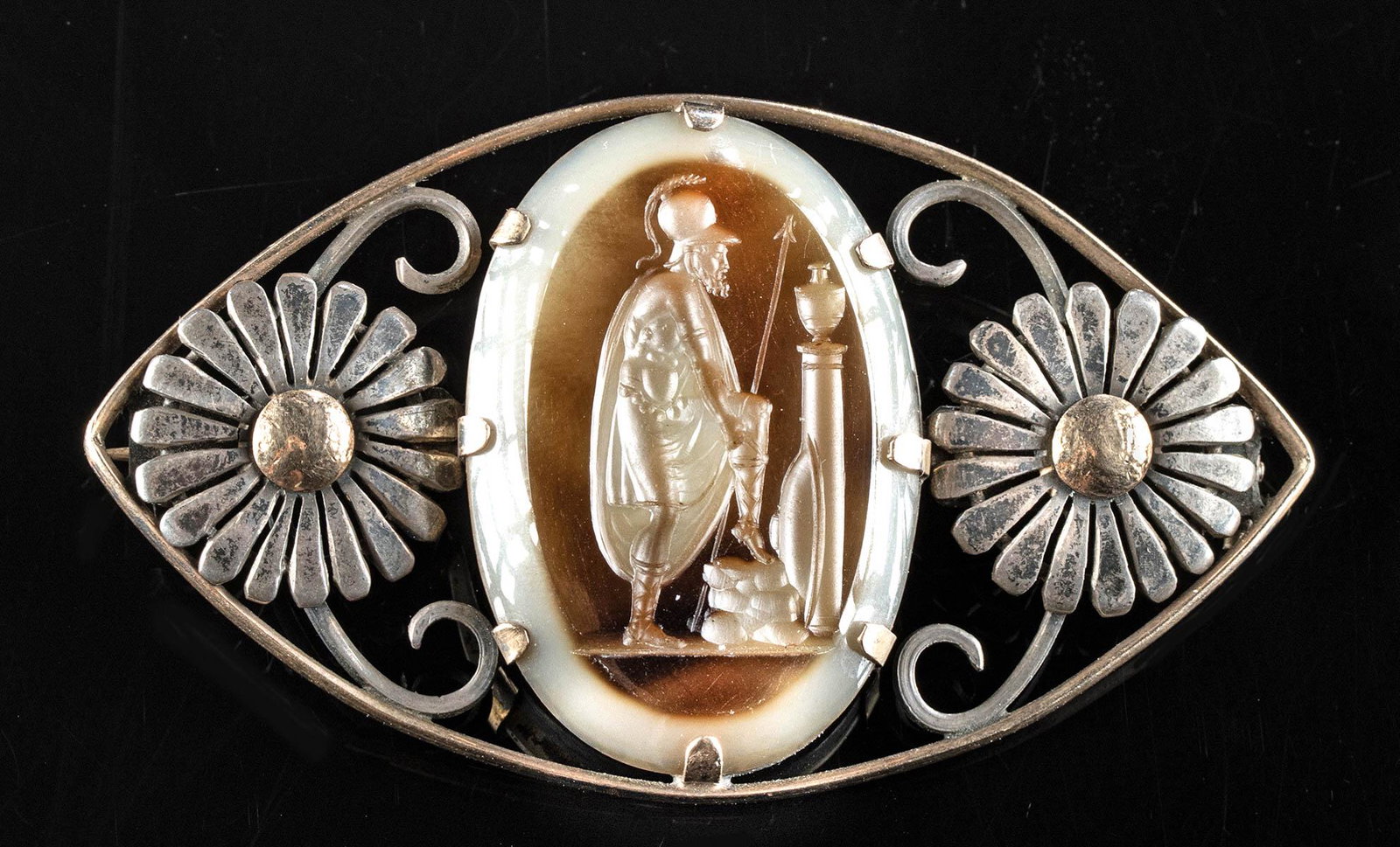 Neoclassical Gold, Silver, Banded Agate Intaglio Brooch: Europe, Neoclassical, late 18th to early 19th century CE. Absolutely breathtaking! A stunning Neoclassical brooch featuring an oval banded agate intaglio, finely carved with a depiction of the mighty 