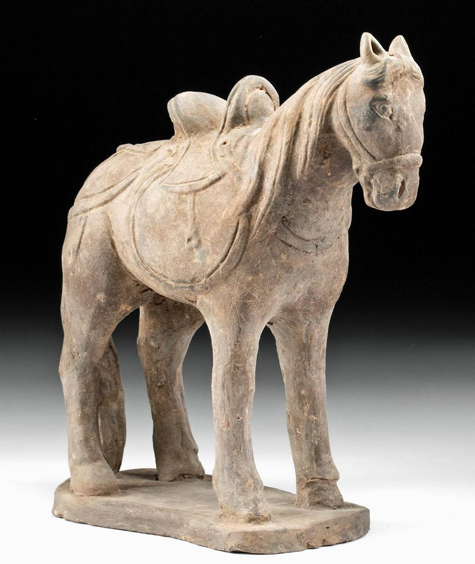 Chinese Ming Dynasty Pottery Mongolian Horse: East Asia, China, Ming Dynasty, 1368 to 1644 CE. A very fine ceramic Mongolian horse, depicted standing upon a curvaceous plinth, with a substantial saddle on its back, well-delineated reins, a long m
