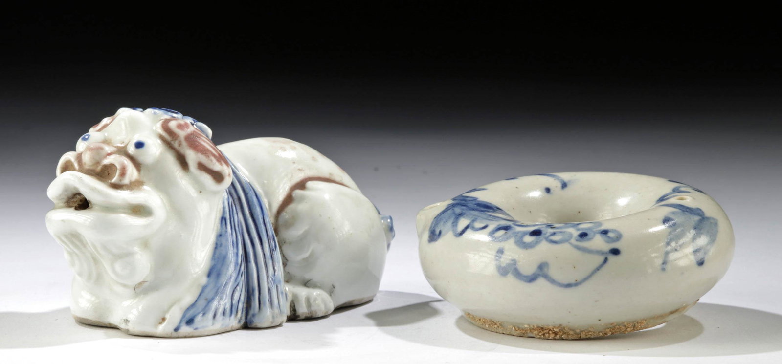 19th C. Korean Porcelain Water Droppers, Yong + Ring: East Asia, Korea, Joseon Dynasty, ca. 19th century CE. A delightful pair of blue-on-white porcelain water droppers. The first is ring shaped, with pretty floral motifs painted on its rounded upper sur