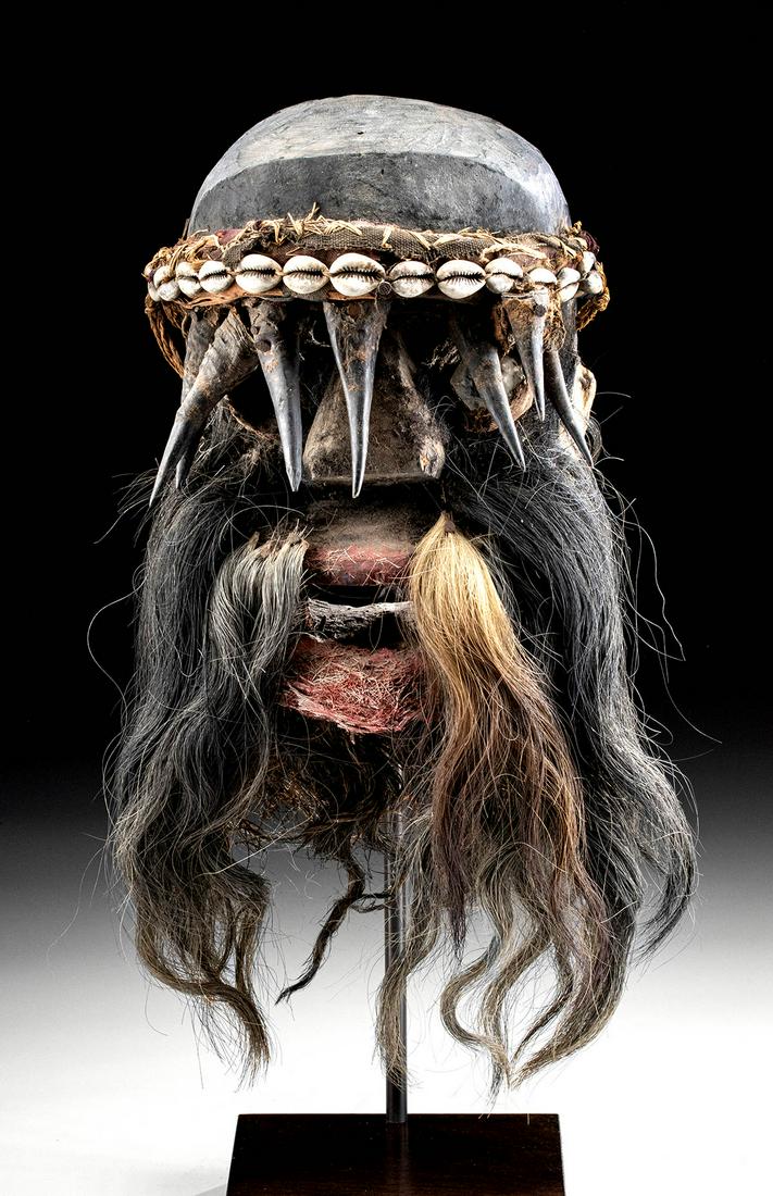 20th C. African Ivory Coast Gere Face Mask: West Africa, Ivory Coast, Gere (also Ngere or Guere) peoples, ca. early to mid-20th century CE. A hand-carved wooden face mask with a pair of petite eye holes drilled above the bulbous nose. The 'eyes