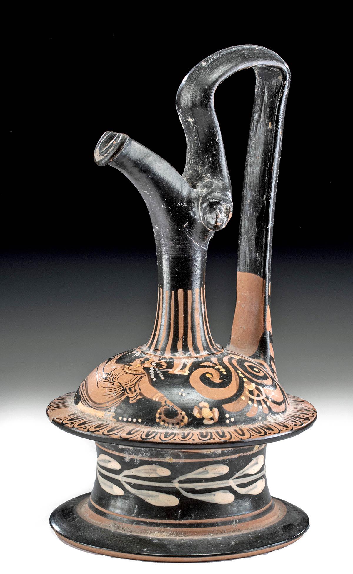 Greek Apulian Red-Figure Epichysis w/ Maenad: Magna Graecia, Southern Italy, Apulian, ca. 330 BCE. A very fine pottery pouring vessel known as an epichysis, possessing a characteristically spool-shaped base with a curved low body leading to a tub