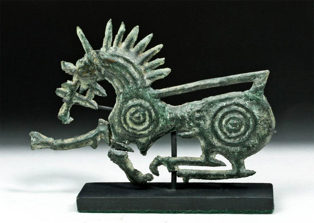 Striking Scythian Bronze Applique - Stylized Horse: Central Asia, Scythian, ca. 900 to 200 BCE. A breathtaking cast bronze applique depicting a horse in motion with magical details including a stylized mane, and a spiral motif over the front and hind q
