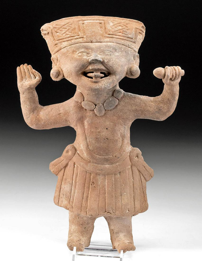 Delightful Veracruz Pottery Standing Sonriente: Pre-Columbian, Gulf Coast of Mexico, Vera Cruz, Remojadas, ca. 600 to 900 CE. Pottery sonriente - literally translating to "smiling face." A young standing boy with arms extended upward at his sides, 