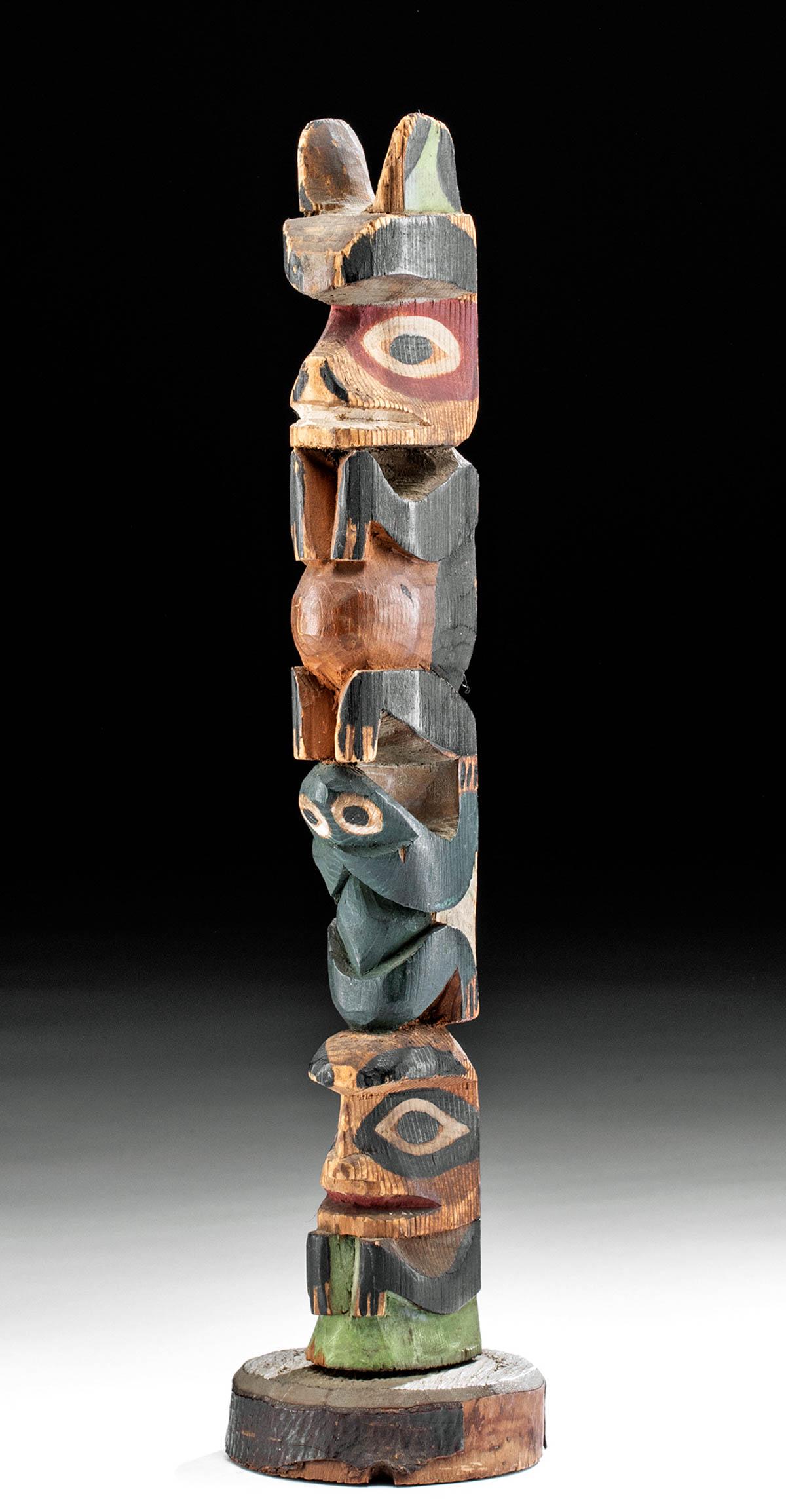 20th C. Pacific Northwest Coast Painted Wood Totem Pole: Native American, Pacific Northwest Coast, ca. early to mid-20th century CE. A beautiful totem pole carved from finely grained red cedar atop a separate discoid platform. The pole is intricately carved