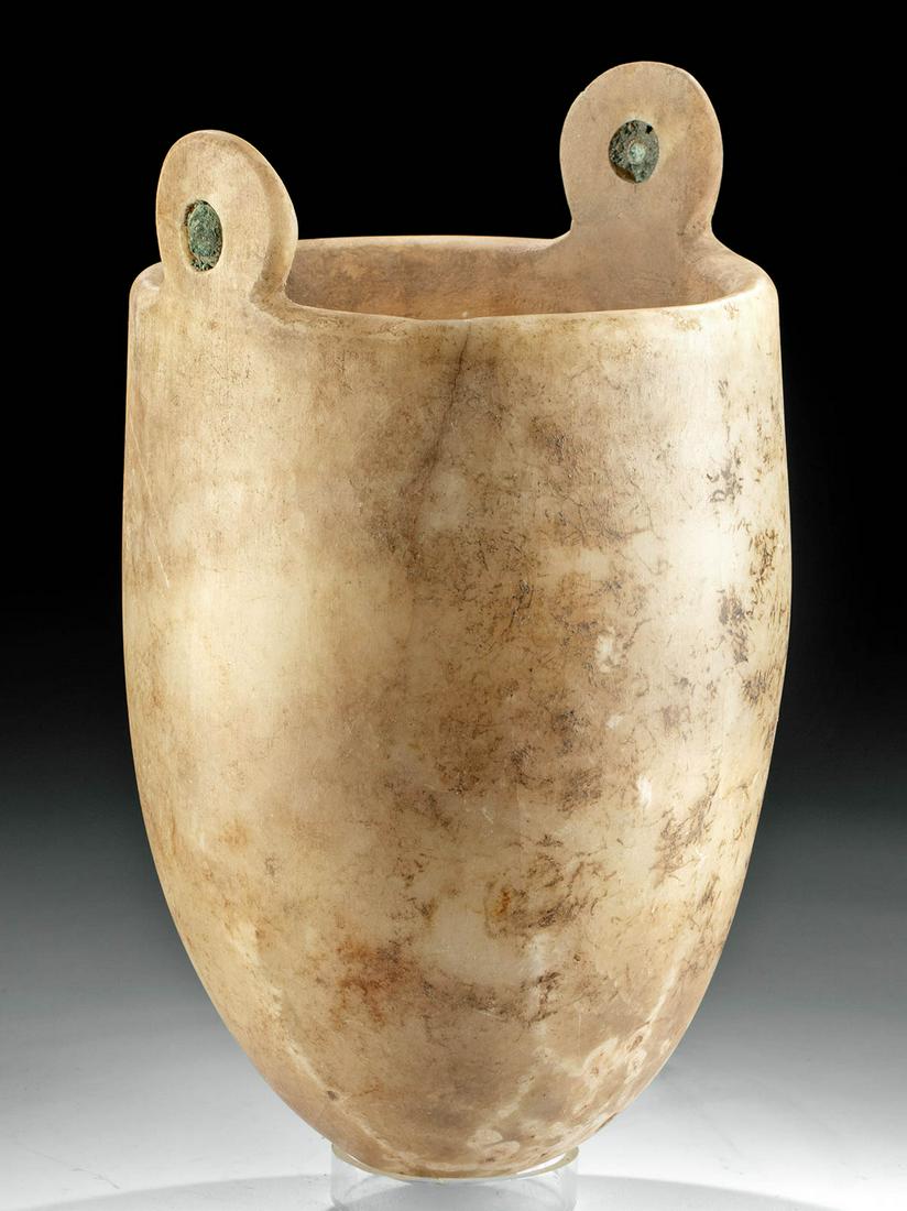 Published / Rare Egyptian Alabaster Situla: Ancient Egypt, Third Intermediate Period, 21st to 25th Dynasty, ca. 1070 to 664 BCE. An incredibly rare example of a sizable situla exhibiting a broad form, hand-carved from honey-yellow alabaster wit