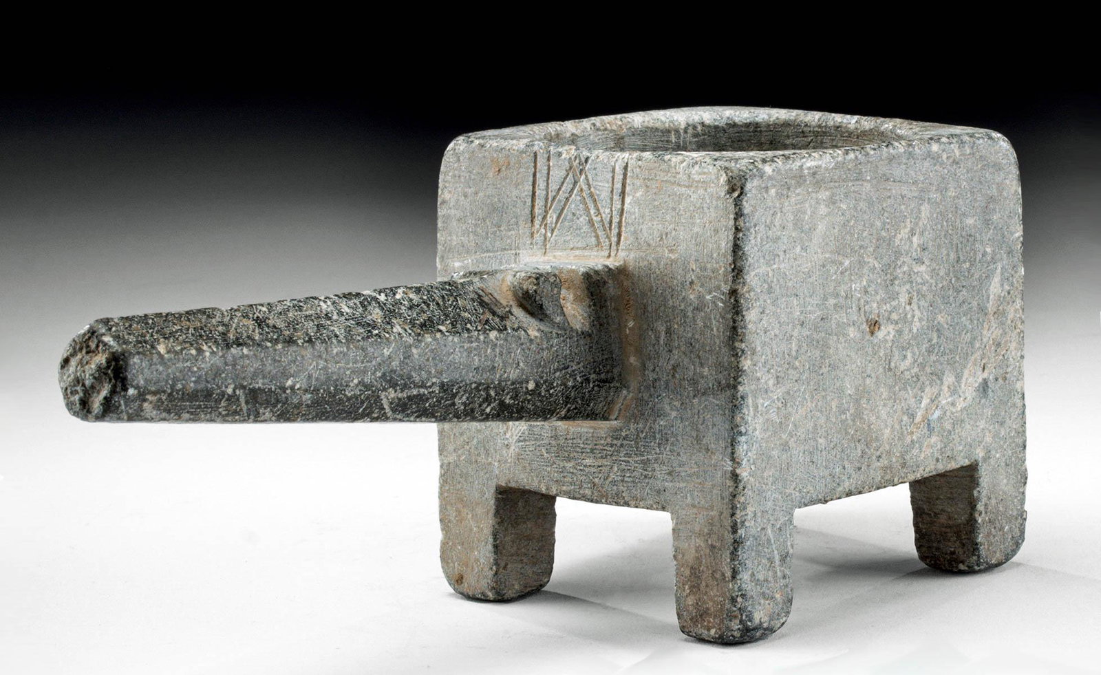 Bactrian Stone Basin / Censor w/ Handle: Central Asia, Bactria, ca. 2nd millennium BCE. A handsome grey schist censer with a conical handle and a cuboid body. The body is drilled out into a wide, cylindrical opening with smooth sides and a f