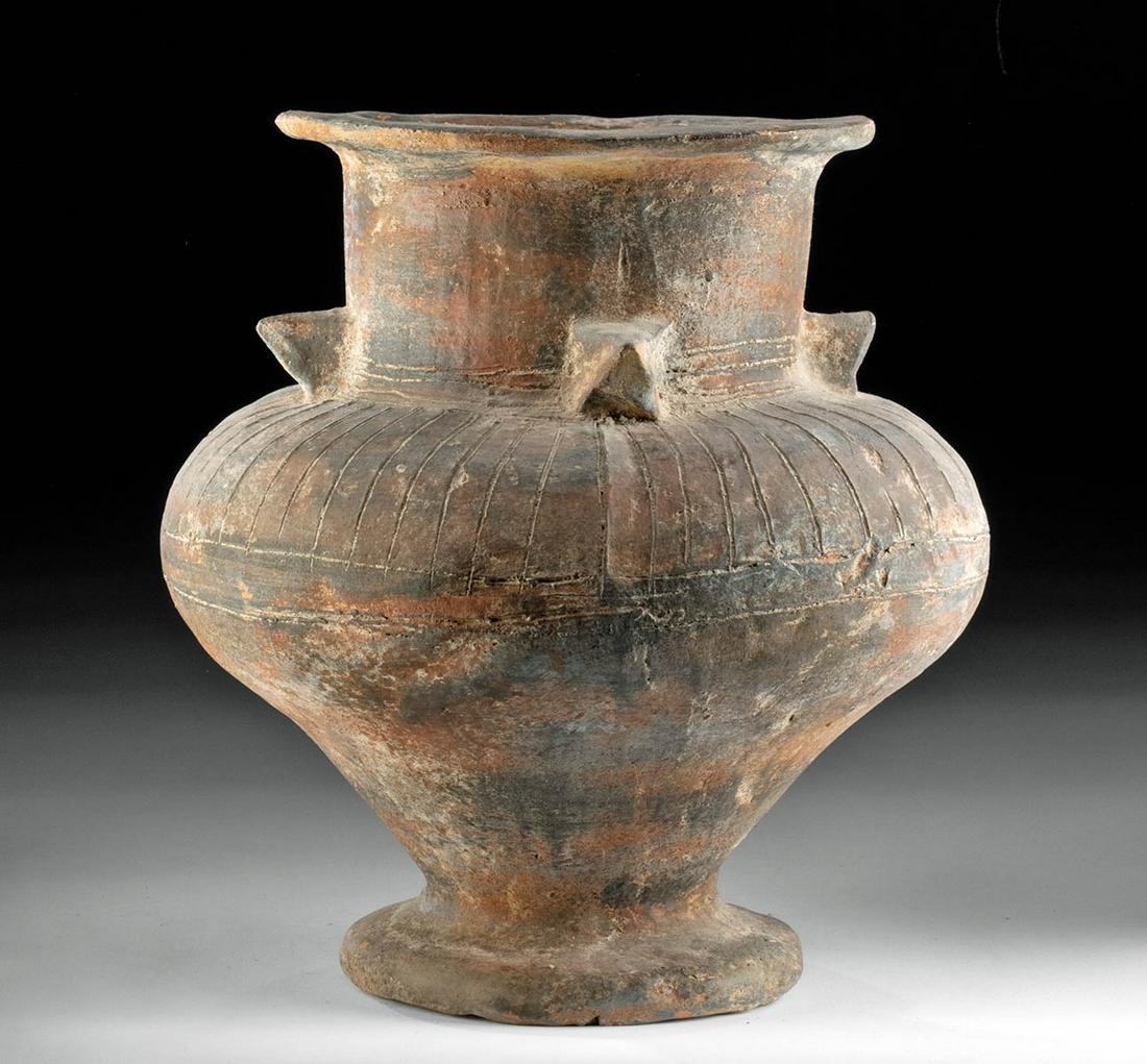 Large Indus Valley Harappan Pottery Vase: Ancient Central Asia, Indus Valley, Harappan/Mohenjo-Daro civilization, ca. 2700 to 2000 BCE. A sizable, hand-built pottery vase adorned with dozens of incised striations as well as faint red pigment.