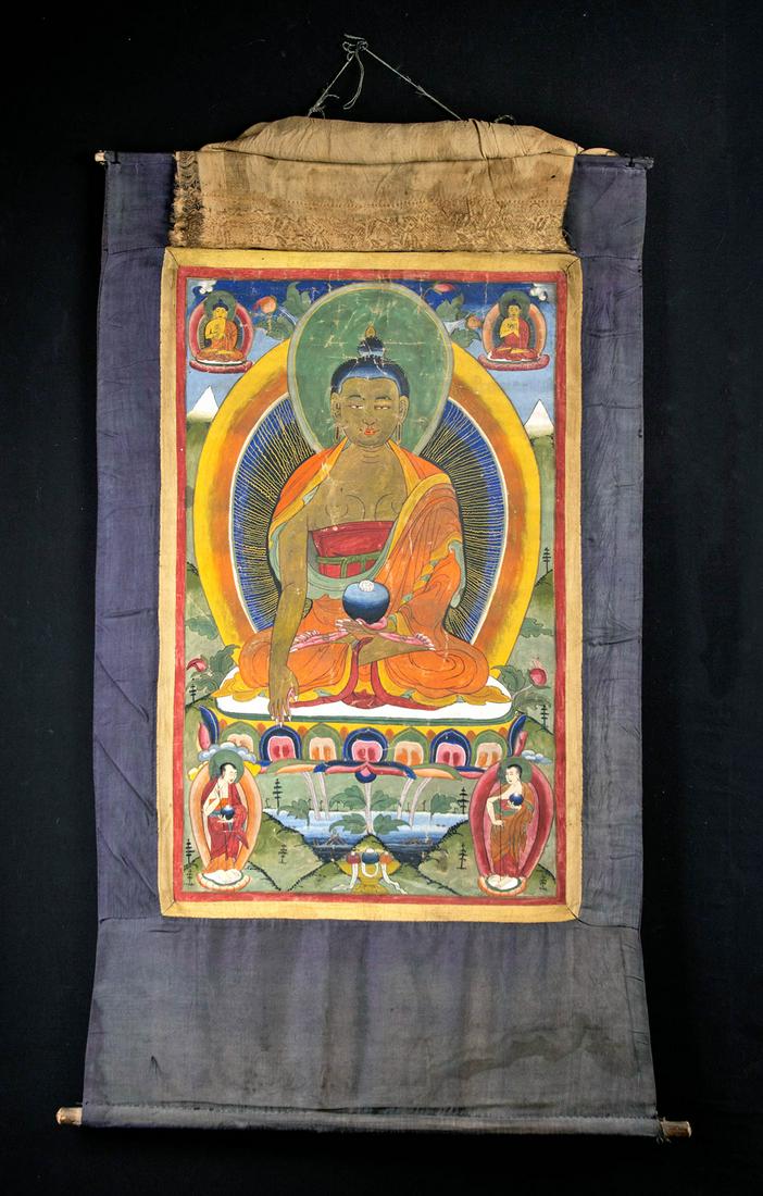 20th C. Tibetan Painted Thangka w/ Shakyamuni Buddha: Central Asia, Tibet, ca. early to mid-20th century CE. A fine thangka featuring a painted obverse scene of the Shakyamuni Buddha seated atop a tiered lotus base. Buddha wears a flowing orange and teal