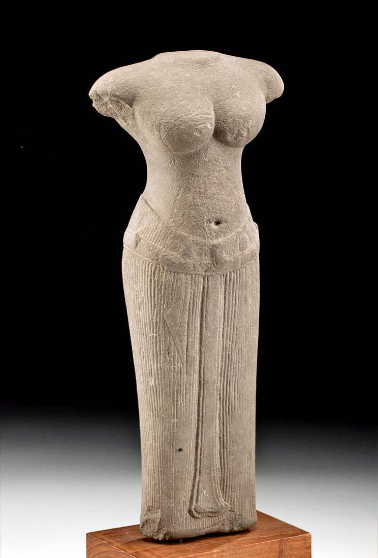 Khmer Stone Female Statue - Uma: Southeast Asia, Cambodia, Khmer Empire (Angkor culture), ca. 12th century CE. A skillfully carved, monumental stone statue of a female, perhaps the goddess Uma, depicted in the round and facing forwar