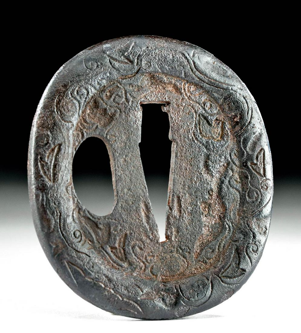 18th C. Japanese Edo Iron Tsuba: East Asia, Japan, Edo Period, ca. 18th century CE. A lovely forged-iron tsuba, a disc-shaped hand guard traditionally placed between the blade and handle of Japanese swords. The surface is decorated w
