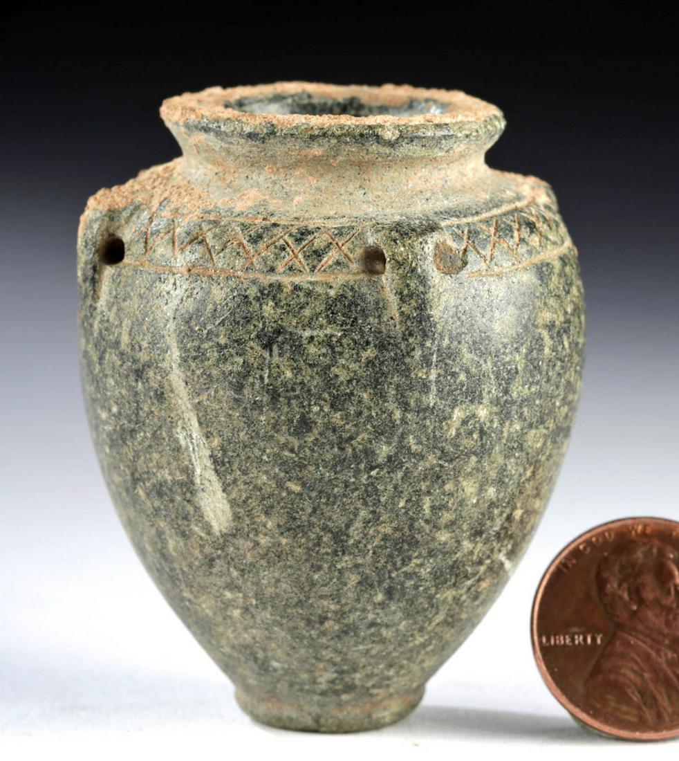 Miniature Ancient Bactrian Schist Jar - Incised Motifs: **Originally Listed At $500** Ancient Central Asia, Bactrian, ca. 2500 to 2250 BCE. A lovely jar of a miniature form, hand-carved from forest-green schist with dark grey inclusions. The piriform body