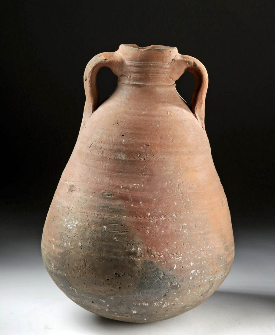 6th C. Holyland Byzantine Pottery Storage Jar: **Originally Listed At $400** Near East / Holy Land, Byzantine Empire, ca. 6th to 10th century CE. A wide-bodied, amphora-shaped vessel for storage and transport of goods. It has a thick neck and rim 