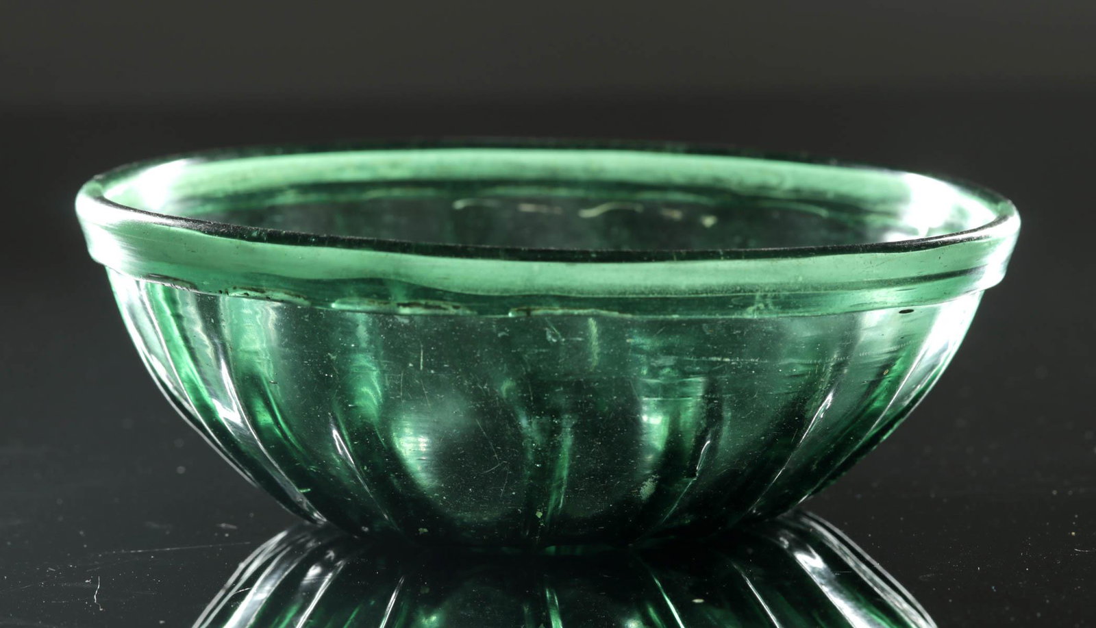 7th C. Islamic Glass Bowl - Gorgeous Green: **Originally Listed At $2500** Early Islamic, ca. 7th to 10th century CE, after an earlier variant in the Roman Empire which was done from 1st to 4th century CE. A beautiful ribbed glass bowl with 19 