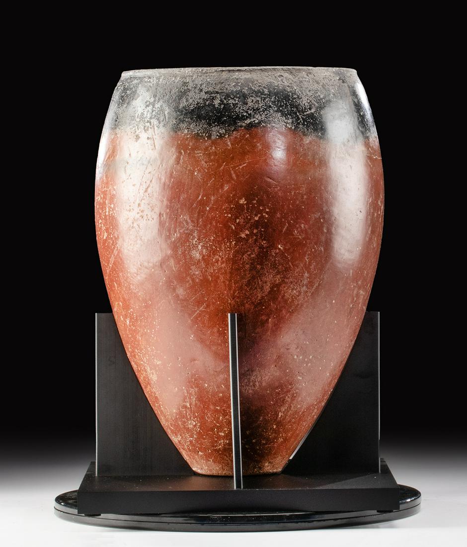 Huge Egyptian Predynastic Blacktop Jar, TL Tested: Ancient Egypt, Predynastic Period, early Naqada II, ca. 3500 to 3400 BCE. A coil-formed redware pottery jar of an outstanding size exhibiting an inverted piriform body with a flat base, a carinated mi