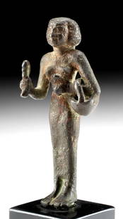 Exhibited Egyptian Leaded Copper Priestess of Bastet: Ancient Egypt, Third Intermediate Period, 22nd Dynasty, ca. 943 to 720 BCE. A stunningly well-preserved female figure depicting a priestess of Bastet, the cat-headed goddess of joy and the moon. Cast