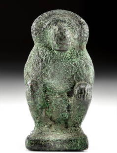 Rare Egyptian Copper Figure Baboon Headed Thoth: Ancient Egypt, New Kingdom, 19th to 20th Dynasty, ca. 1292 to 1070 BCE. A cast-copper figure of the baboon-headed version of Thoth, the god of writing, accounting, and other intellectual pursuits.