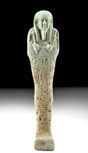 Fine Egyptian Glazed Faience Ushabti: Egypt, Late Dynastic Period, 26th to 31st Dynasty, ca. 664 to 332 BCE. A beautiful ushabti figure that is mold-formed from faience and covered in soft blue-green glaze. The regal figure stands with