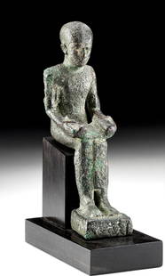 Egyptian Copper Imhotep, ex-Sothebys, ex-Royal Athena: Egypt, Late Period, XXVI Dynasty, 664 to 525 BCE. A finely cast copper alloy statue of Imhotep, the Egyptian god of medicine and learning, seated and holding an open papyrus scroll with an