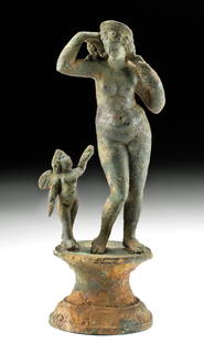 Exhibited Romano-Egyptian Bronze Venus & Cupid: Egypt, Romano-Egyptian, ca. 1st century BCE to 1st century CE. Skillfully cast via the lost wax (cire perdue) process, a leaded bronze statue of Venus (Greek Aphrodite), the goddess of love and