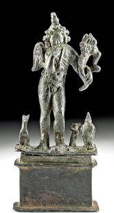 Roman-Egyptian Bronze Pantheistic Harpokrates, ex-Kluge: Egypt, Romano Egyptian, ca. 1st to 2nd century CE. A very fine Romano-Egyptian leaded-bronze statue of a pantheistic Harpokrates, winged and crowned, holding a cornucopia with an owl (though missing