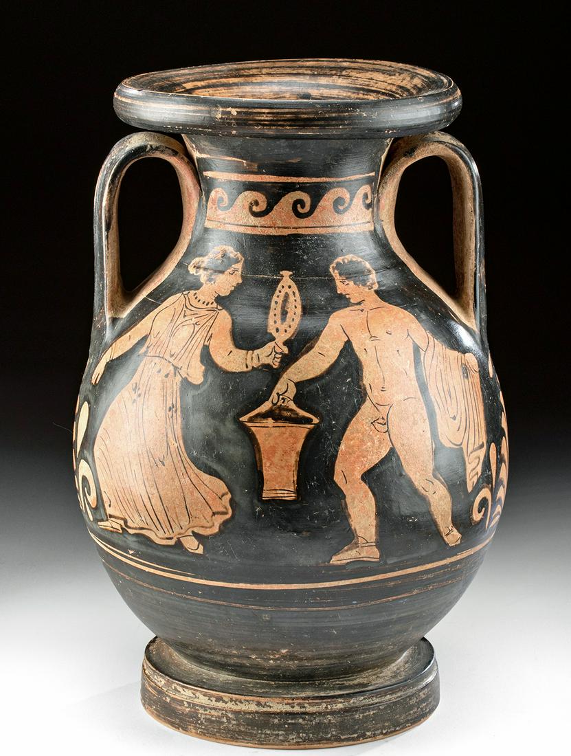 Greek Apulian Red-Figure Pelike Female, Nude Male: Magna Graecia, Southern Italy, Apulia, ca. 330 BCE. Finely painted via the red-figure technique, an elegant and very large pelike vessel of a classic globular form with a cylindridal neck rising to a 