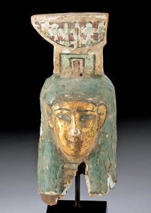 Egyptian Ptolemaic Gilded Gesso / Wood Head of Nephthys: Egypt, Ptolemaic Period, ca. 332 to 30 BCE. A carved wooden head of a gorgeous form depicting Nephthys, sister of Isis, goddess of death and darkness, and one of the oldest deities in the Egyptian