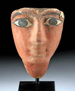 Fine Egyptian Painted Gesso Cedar Mummy Mask: Egypt, Late Dynastic Period, 26th to 31st Dynasty, ca. 664 to 332 BCE. A beautiful mummy mask that is expertly carved from cedar and covered in a layer of white gesso decorated with thick, opaque