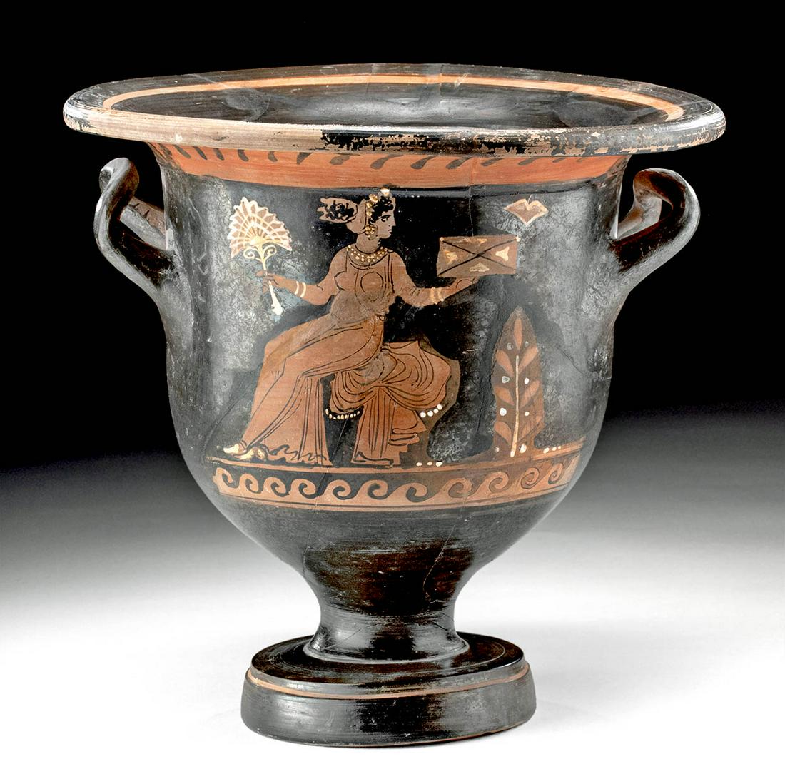 Greek Paestum Red-Figure Bell Krater: Greece, South Italian, probably Paestum, ca. 370 to 325 BCE. A lovely bell krater, composed of thick terracotta, slipped in black with red figures. This vessel depicts two scenes. Side A has a standin