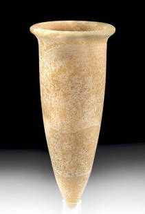 Egyptian Old Kingdom Banded Alabaster Jar: Ancient Egypt, Old Kingdom, 3rd to 6th Dynasty, ca. 2686 to 2181 BCE. A superb jar carved from honey-yellow banded alabaster of a cylindrical form that tapers dramatically to a conical base. The tall