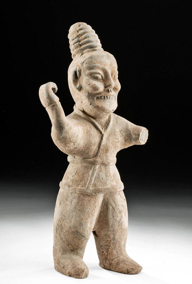 Chinese Western Jin Dynasty Pottery Spear Thrower: East Asia, China, Western Jin Dynasty, ca. 266 to 316 CE. A hollow-molded pottery tomb guardian figure of a spear thrower standing in a dynamic stance as if preparing to hurl his polearm forward. The