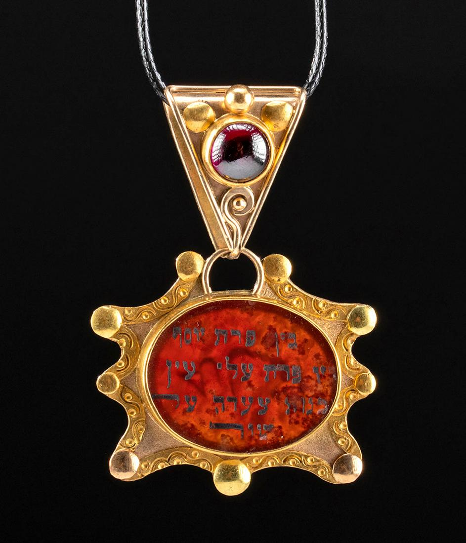 20K Gold Pendant w/ Carnelian, Incribed Garnet: Near East, Israel, ca. 20th century CE. A stunning wearable gold pendant comprised of two pieces; an upper part presenting as an upside-down triangle connected to the bottom by a loop and a lower piec