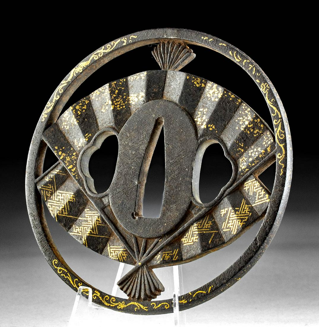 Japanese Edo Gilt Iron Tsuba w/ Fan Design: East Asia, Japan, Edo Period, ca. late 18th to early 19th century CE. A fabulous forged-iron maru-gata (round) tsuba, a disc-shaped hand guard traditionally employed on Japanese swords. The decorative