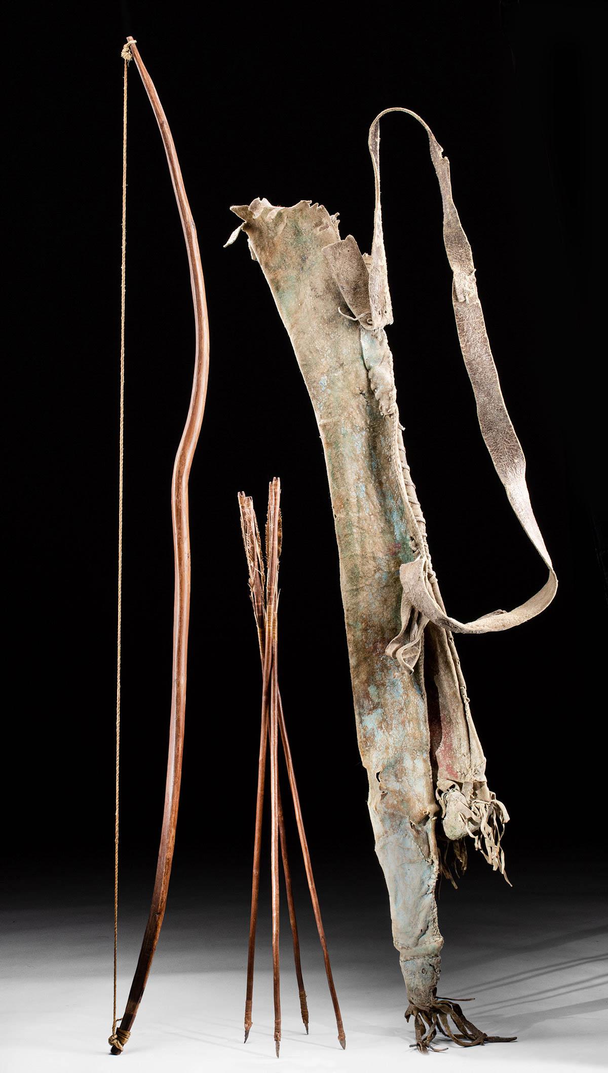 19th C. Pueblo Hide Bow Case & Quiver w/ Bow & 4 Arrows: Native American, North America, Southwest, Pueblo, ca. 1820 to 1850 CE. An outstanding Pueblo deer hide bow case and quiver with four matching wooden, flint-tipped arrows. A magnificent ensemble, the