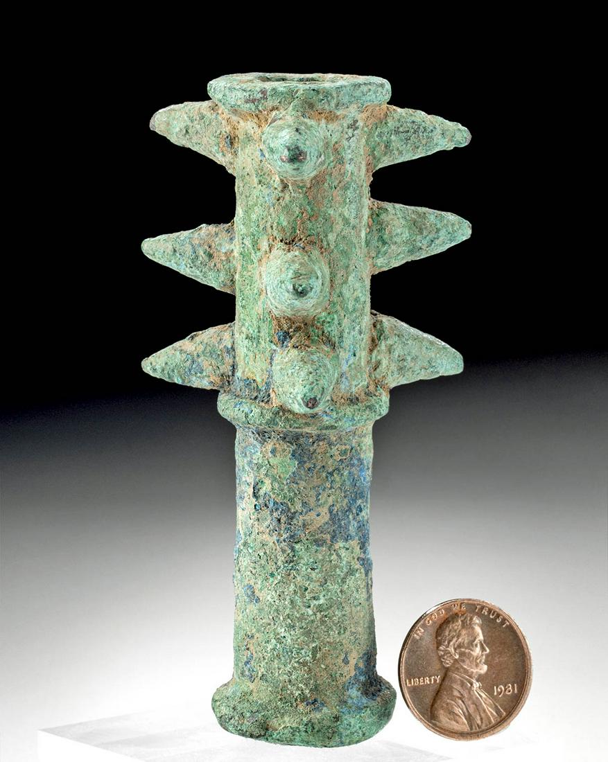 Luristan Copper Mace Head w/ Dangerous Spikes: Ancient Near East, northwestern Iran, Luristan, ca. 1200 to 800 BCE. A copper mace head of a generally cylindrical form, intended to fit a long metal or wooden staff, with 3 rows of 3 long, pointy spi