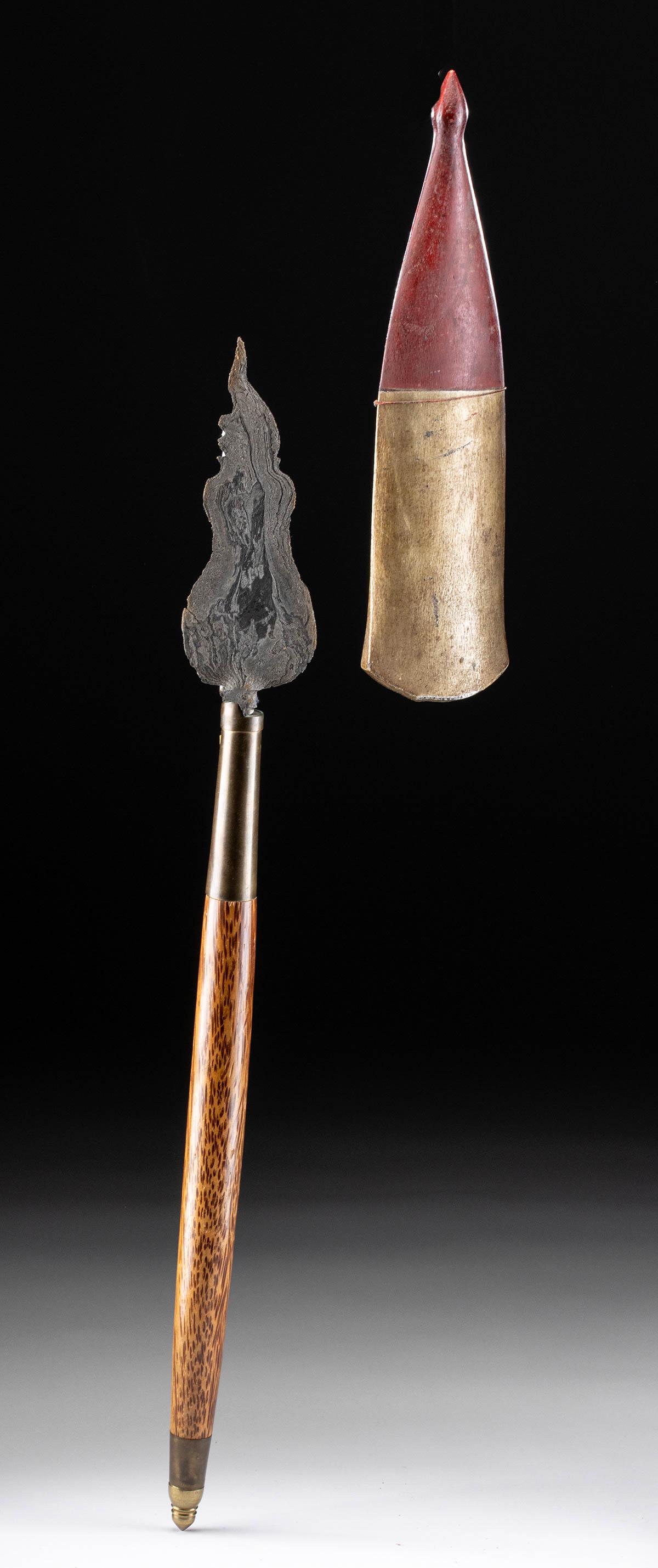 19th C. Indonesian Steel Tombak, Wood Handle + Scabbard: Southeast Asia, Indonesia, Java, ca. mid-19th to early 20th century CE. A forged-steel ceremonial spear blade known as a tombak with a bulbous, flaming profile bearing sharpened edges and a dramatical