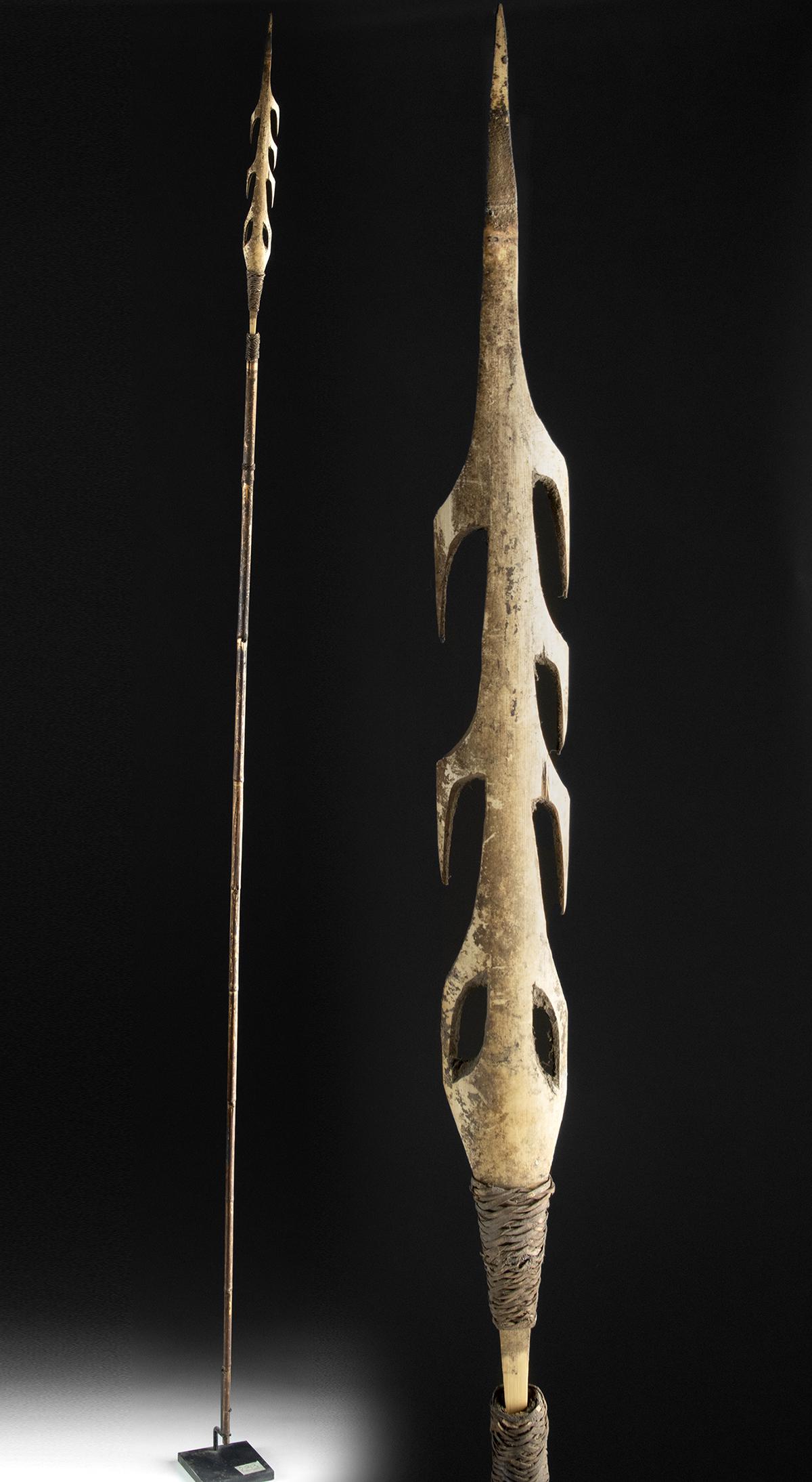 20th C. Indonesian Asmat Wood Spear / Bamboo Shaft: Southeast Asia, Indonesia, western Irian Jaya, Asmat people (who are closely related to people from Papua New Guinea), ca. first half of the 20th century CE. A fine, hand-carved wooden spear with a le
