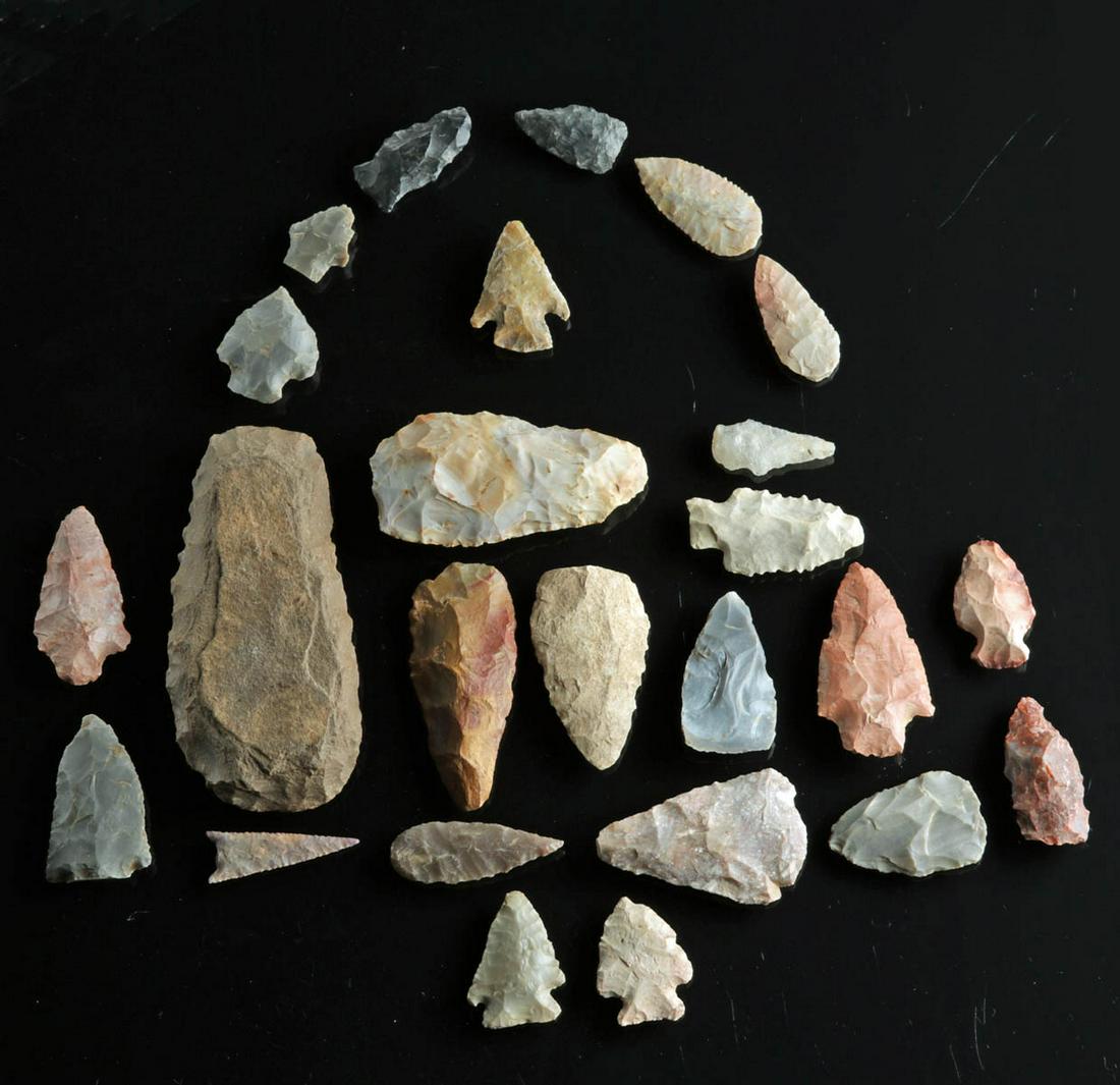 Lot of 25 Native American Stone Arrowheads & Points: Native American, North America, Archaic to Woodland period, ca. 5000 to 500 BCE. A beautiful gathering of twenty-five hand-knapped chert arrowheads and spear points ranging in colors from black, brown