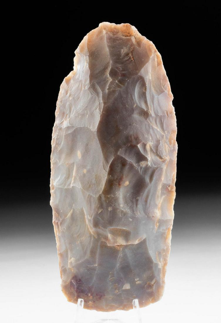 Mousterian Stone Hand Tool from Mauritania: North Africa, Mauritania, Mousterian Period, ca. 120,000 to 40,000 years old. A handsome pale beige chert biface, a stone tool made by Homo neanderthalensis, used as a hand axe. The tool is sizable, w
