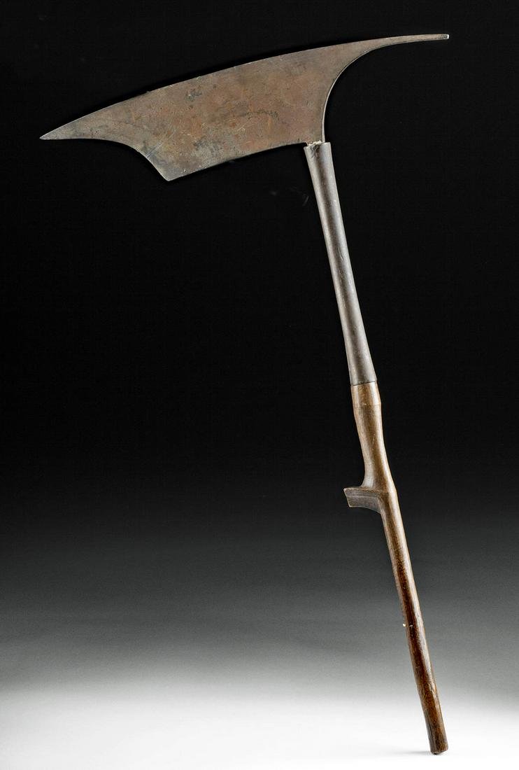 20th C. Filipino Igorot Iron Currency Axe Wood Handle: Southeast Asia, Philippines, northern Luzon, Igorot tribe, ca. first half of the 20th century CE. A fine currency piece in the shape of an ornate axe. The tang of the forged-iron blade is inserted int