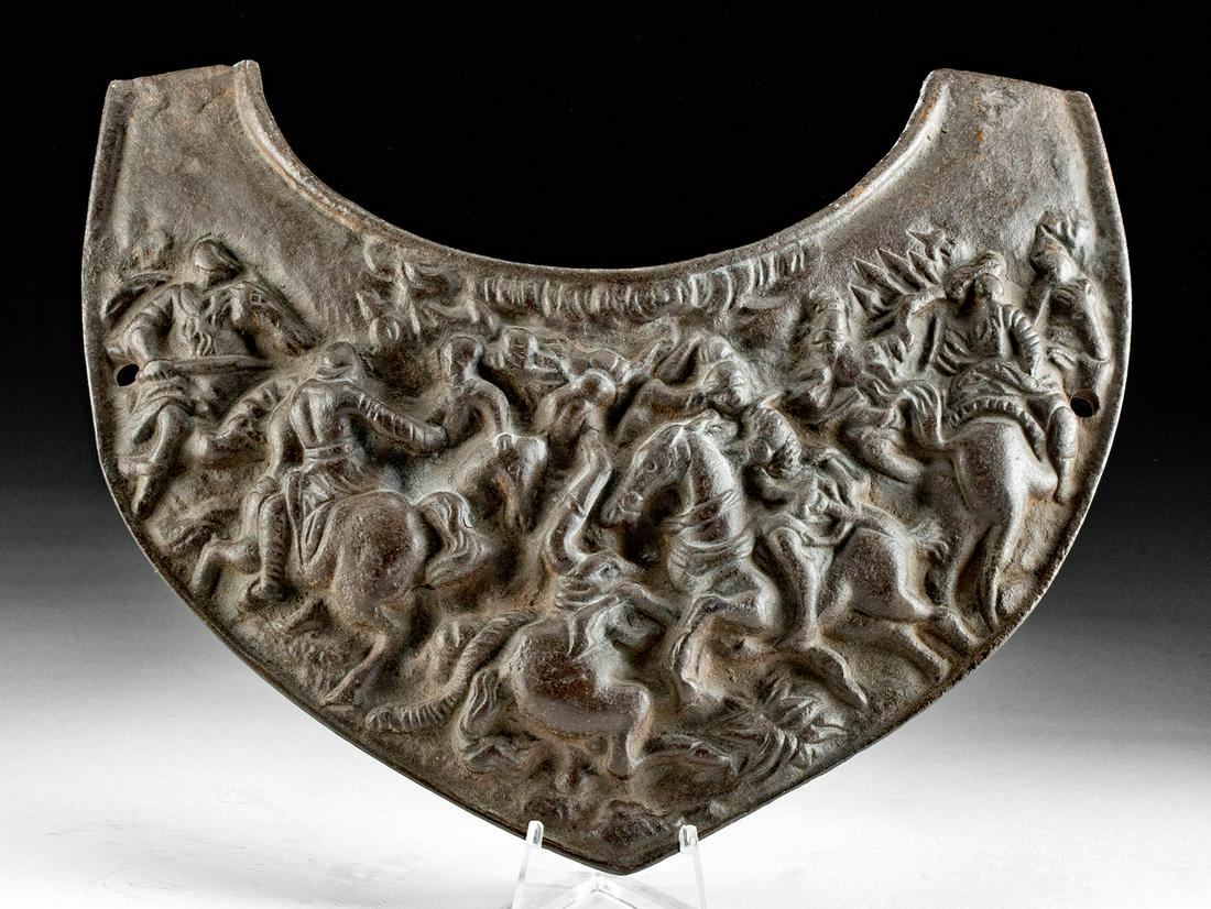 19th C. German Iron Gorget Battle Scene in Relief: Western Europe, probably Germany, ca. 19th century CE. A fantastic die cast iron gorget, or neck armor, with a scene in relief. This finely detailed piece is curved to fit around the neck and rest on