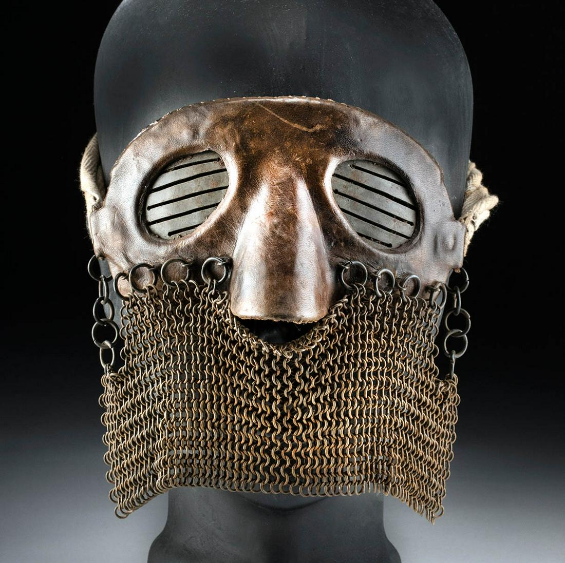 Western European WWI Leather & Iron Mail Splatter Mask: Western Europe, probably England or France, late World War I era, ca. 1917 to 1918 CE. A personal protection device known as a splatter mask used by tank personnel during the European campaigns of Wor