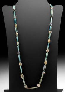 Romano-Egyptian Faience & Glass Bead Necklace: Egypt, Romano-Egyptian Period, ca. 1st to early 5th century CE. A fabulous necklace featuring glazed faience tube beads and petite faience seed-form beads in polychrome colors that alternate with