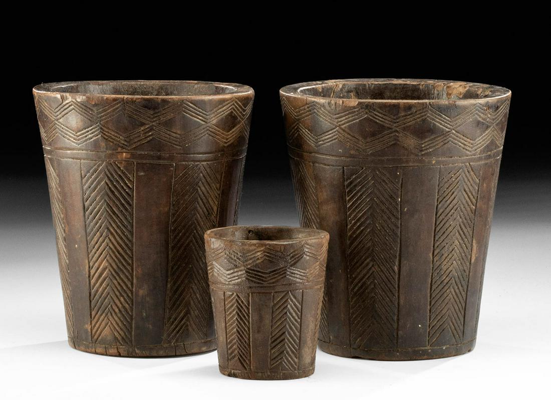 Lot of 3 Matched Inca Wooden Keros: Pre-Columbian, Peru, Inca culture, ca. 1400 to 1532 CE. A beautiful trio of wooden keros - vessels used by the Inca peoples to drink chicha, a native fermented corn beer. The two larger keros are near