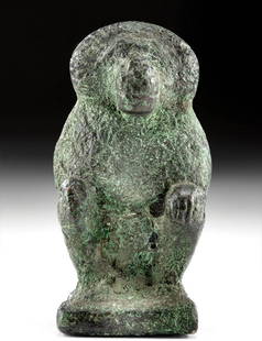 Egyptian Copper Baboon-Headed Thoth Figure: Ancient Egypt, New Kingdom, 19th to 20th Dynasty, ca. 1292 to 1070 BCE. A cast-copper figure of the baboon-headed version of Thoth, the god of writing, accounting, and other intellectual pursuits.